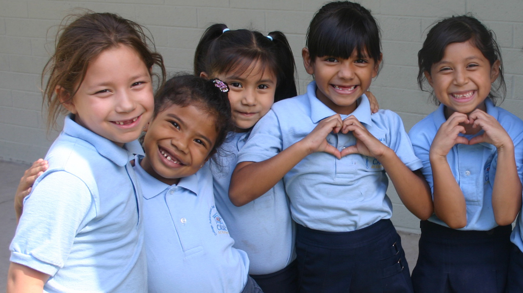 5 smiling female students at CASA Academy