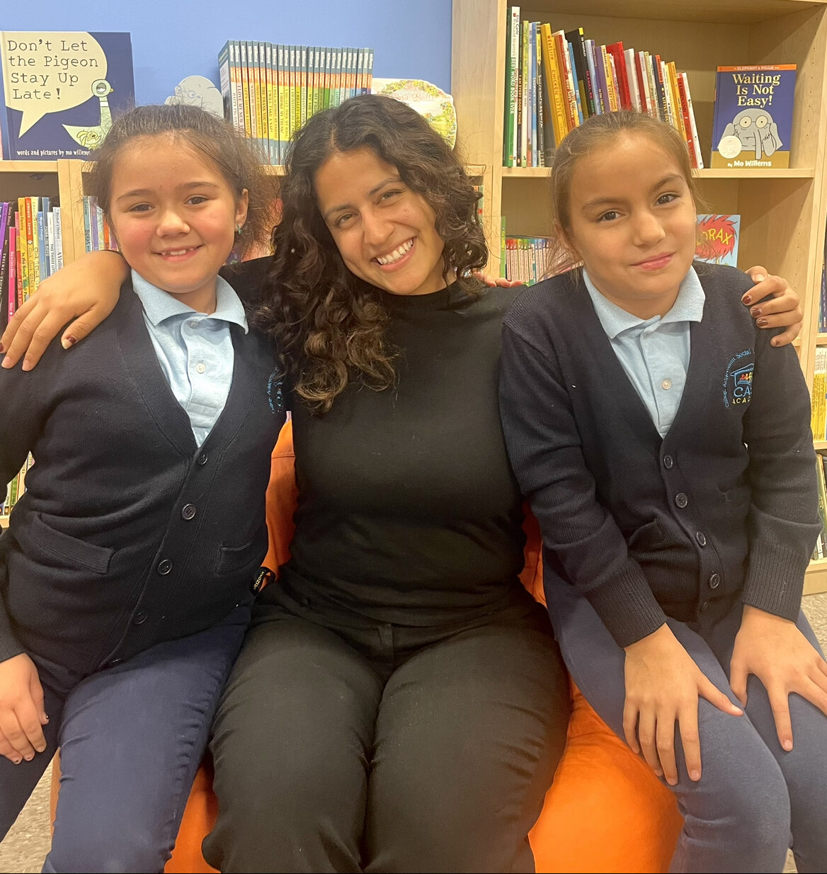 Abigail Verdugo smiles with 2 CASA Academy scholars