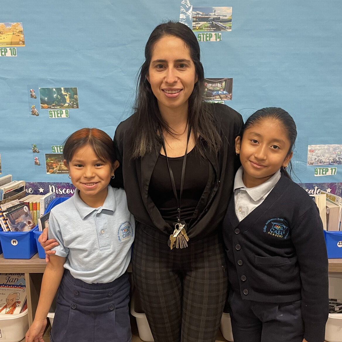 Marina Iturrios smiles with 2 CASA Academy scholars