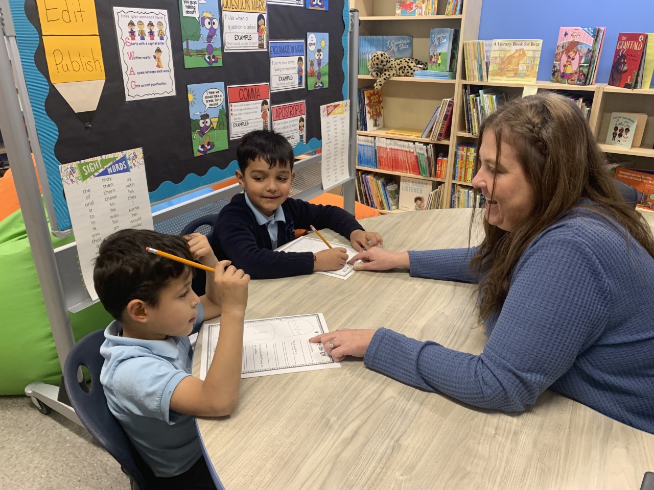 Two CASA Academy scholars work with a special education professional.
